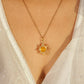Eternal Sun Necklace with Yellow Onyx gold wire wrapped sun pendant worn on model close-up view, handmade healing crystal willpower necklace Sri Lanka by Laganna