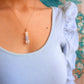 French Palace Column Necklace handmade wire wrapped crystal jewelry featuring rose quartz aquamarine moonstone yellow jade pastel stones inspired by 18th century Rococo Versailles palace elegance French court fashion Marie Antoinette era romantic feminine design worn on model white ruffled top soft candlelight aesthetic artisan crafted Sri Lanka Laganna healing crystals love courage intuition joy optimism new beginnings emotional healing protection good fortune timeless wearable fairytale charm