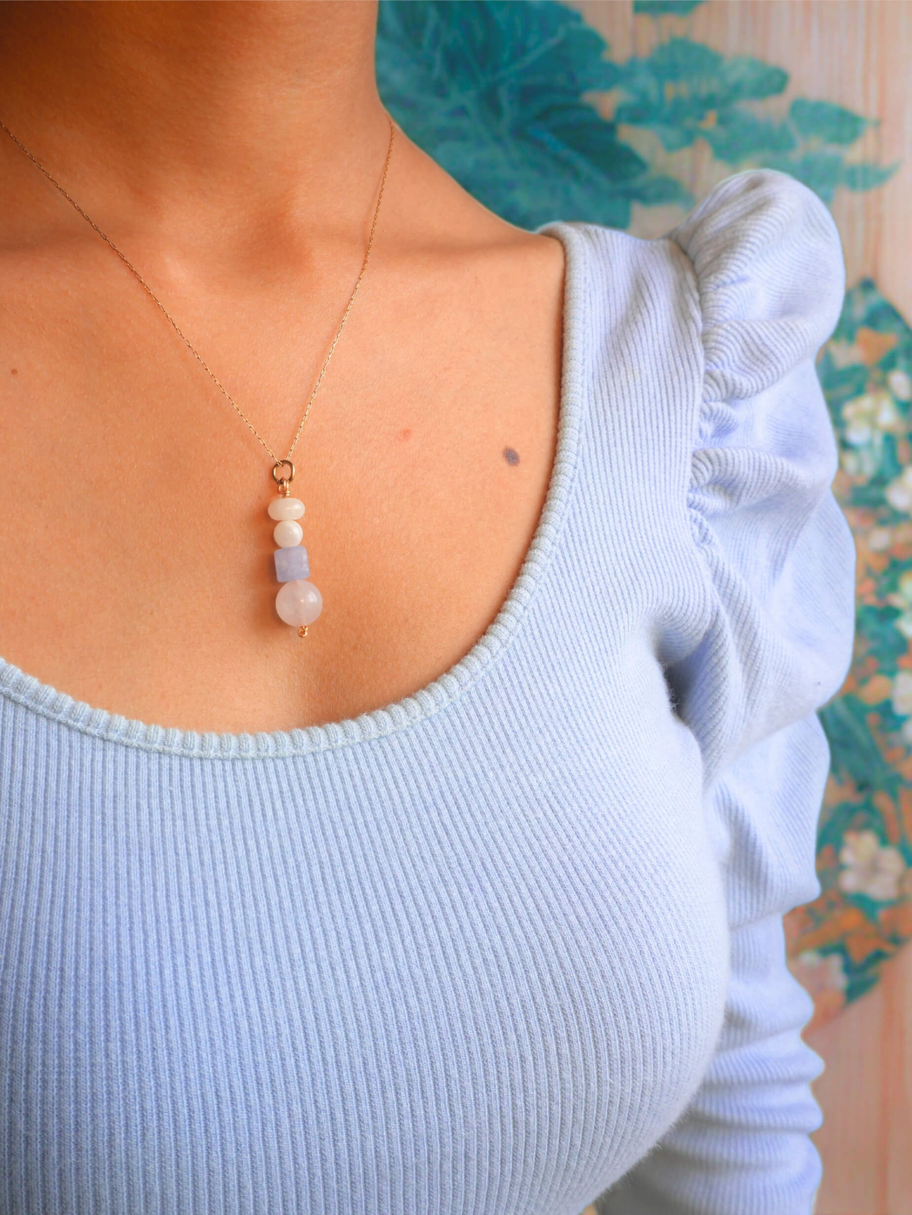 French Palace Column Necklace handmade wire wrapped crystal jewelry featuring rose quartz aquamarine moonstone yellow jade pastel stones inspired by 18th century Rococo Versailles palace elegance French court fashion Marie Antoinette era romantic feminine design worn on model white ruffled top soft candlelight aesthetic artisan crafted Sri Lanka Laganna healing crystals love courage intuition joy optimism new beginnings emotional healing protection good fortune timeless wearable fairytale charm