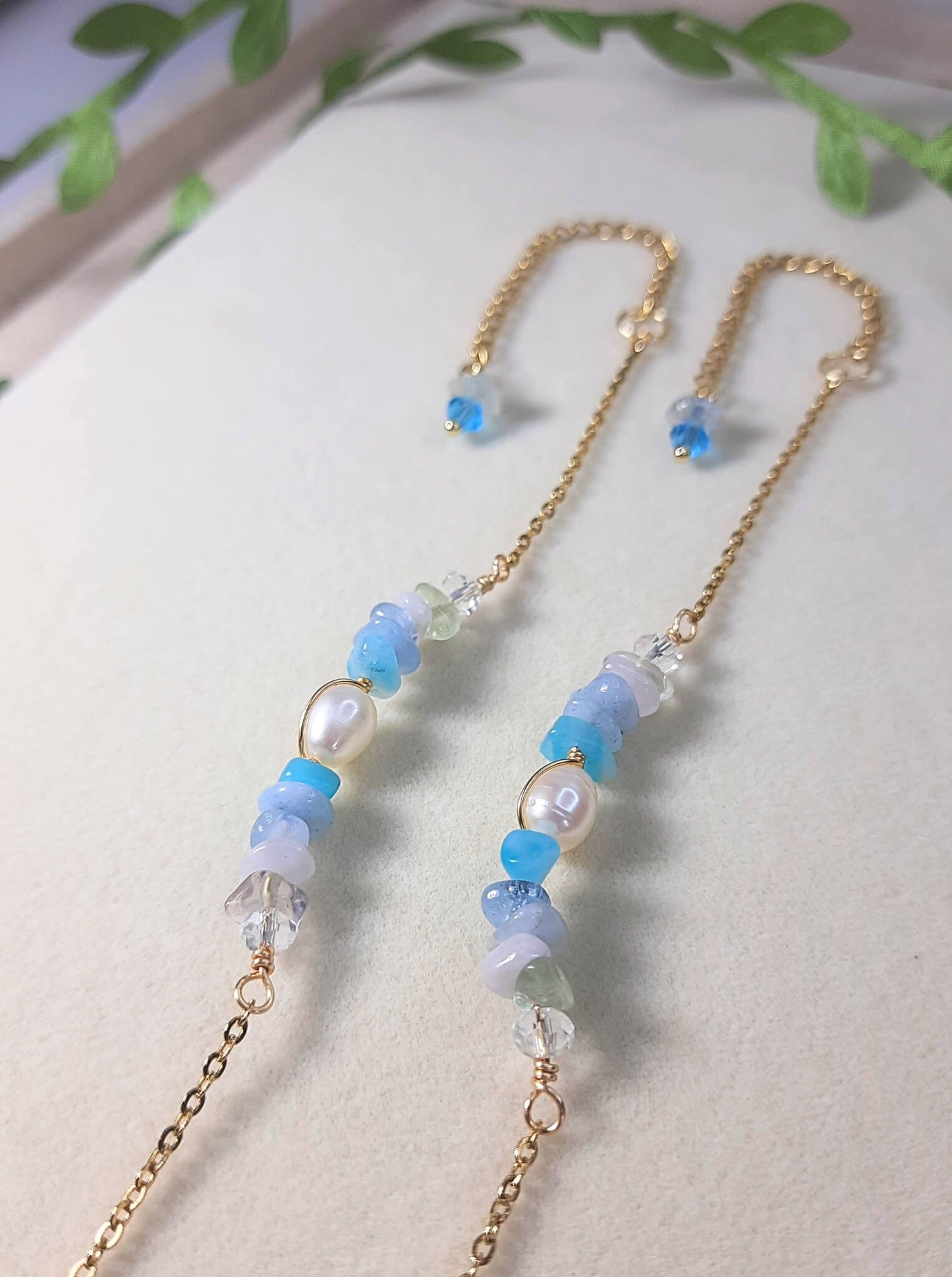Two Freshwater Lake Bracelets in gold showcasing water-inspired crystal collection with aquamarine and blue gemstones, handmade Sri Lanka jewelry