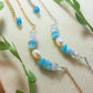 Close-up detail of Freshwater Lake Bracelet in silver wire wrap showing water-inspired crystal palette with aquamarine stones, handmade in Sri Lanka