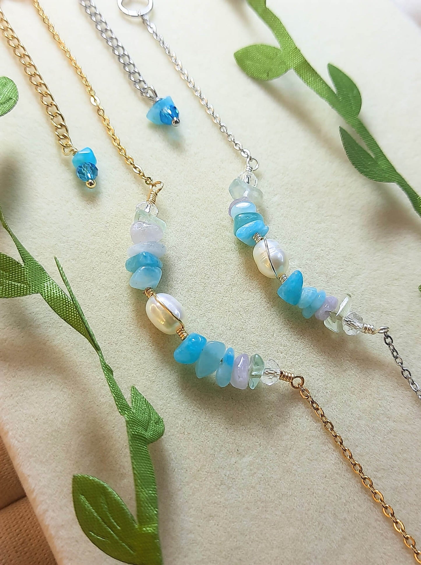 Close-up detail of Freshwater Lake Bracelet in silver wire wrap showing water-inspired crystal palette with aquamarine stones, handmade in Sri Lanka