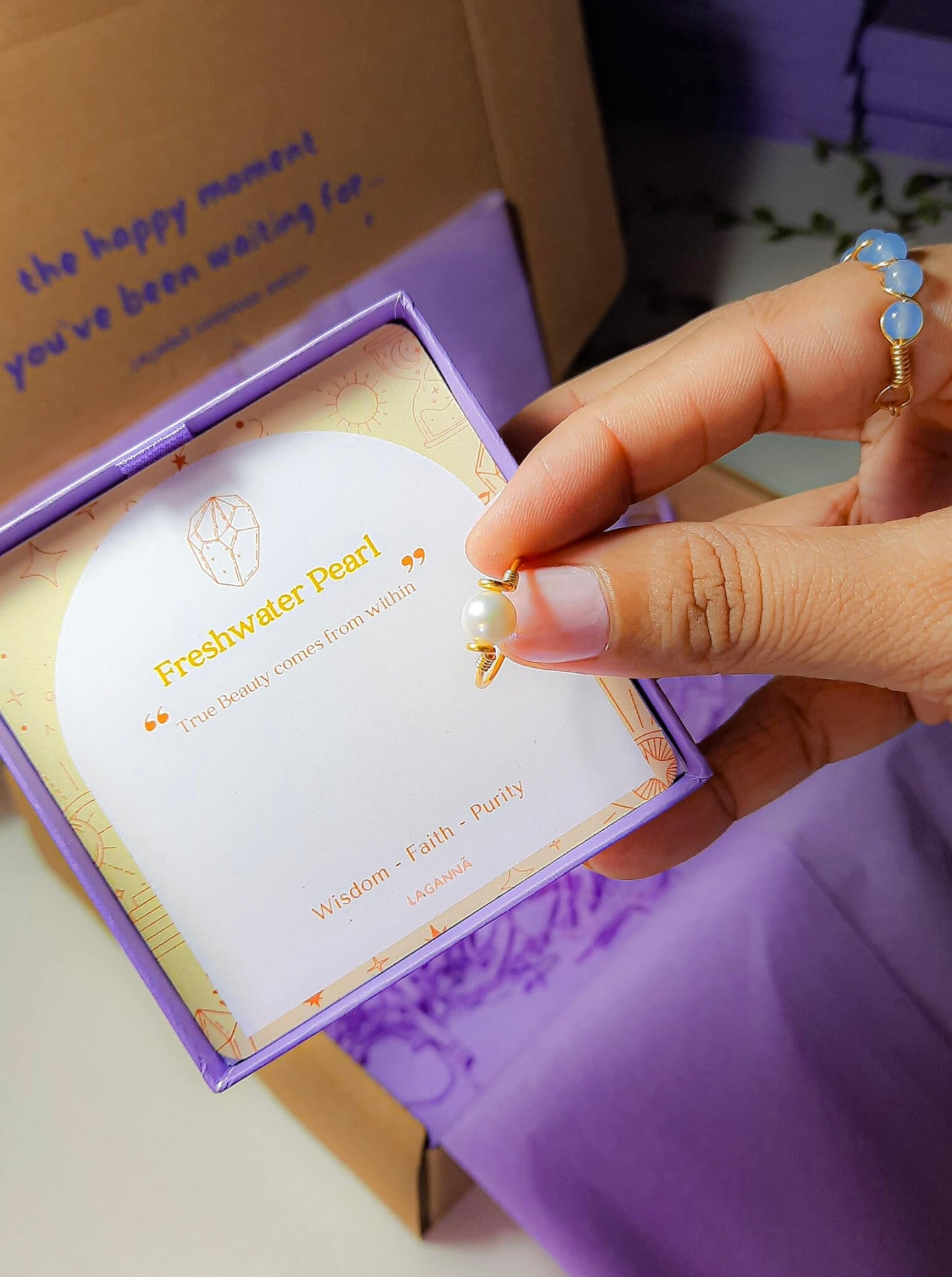 Freshwater pearl dainty ring jewelry box held in hand showing gold wire wrapped design, handmade Sri Lankan pearl jewelry gift for elegance, grace, and inner peace