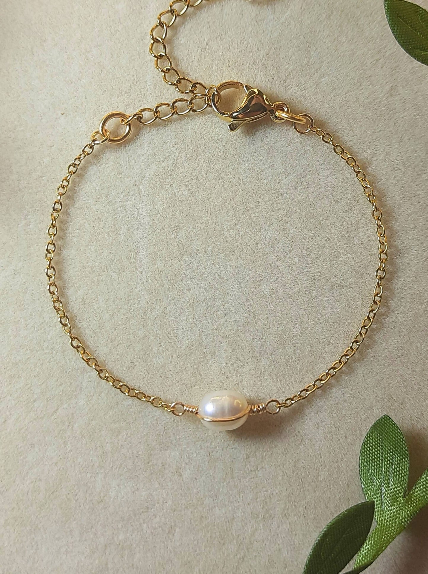 Freshwater pearl bracelet in gold wire wrapped design closeup full look, handmade Sri Lankan pearl jewelry for purity and grace