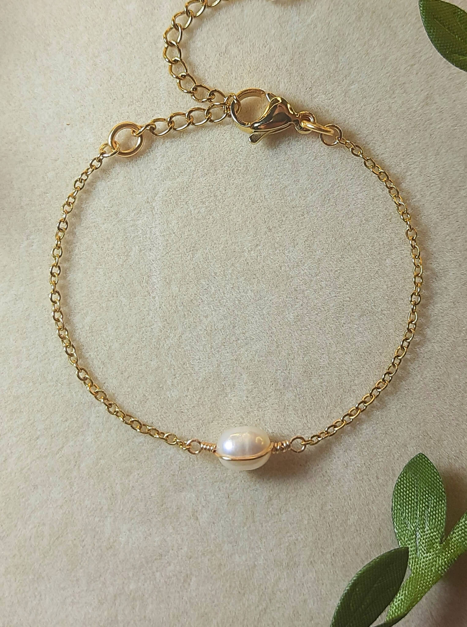Freshwater pearl bracelet in gold wire wrapped design closeup full look, handmade Sri Lankan pearl jewelry for purity and grace