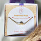 Handmade freshwater pearl bracelet jewelry box aesthetic closeup showing gold wire wrapped design, Sri Lankan pearl jewelry for wisdom and calming energy