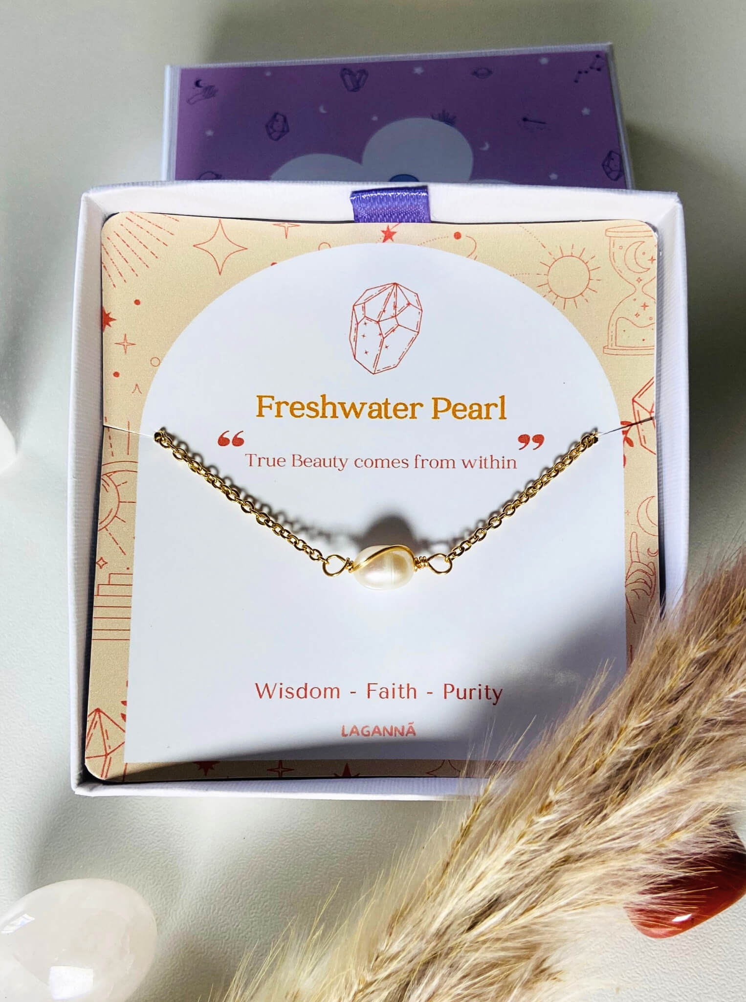 Handmade freshwater pearl bracelet jewelry box aesthetic closeup showing gold wire wrapped design, Sri Lankan pearl jewelry for wisdom and calming energy