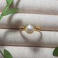 Freshwater pearl ring in gold wire wrapped design on jewelry display, handmade Sri Lankan pearl jewelry for purity and emotional balance