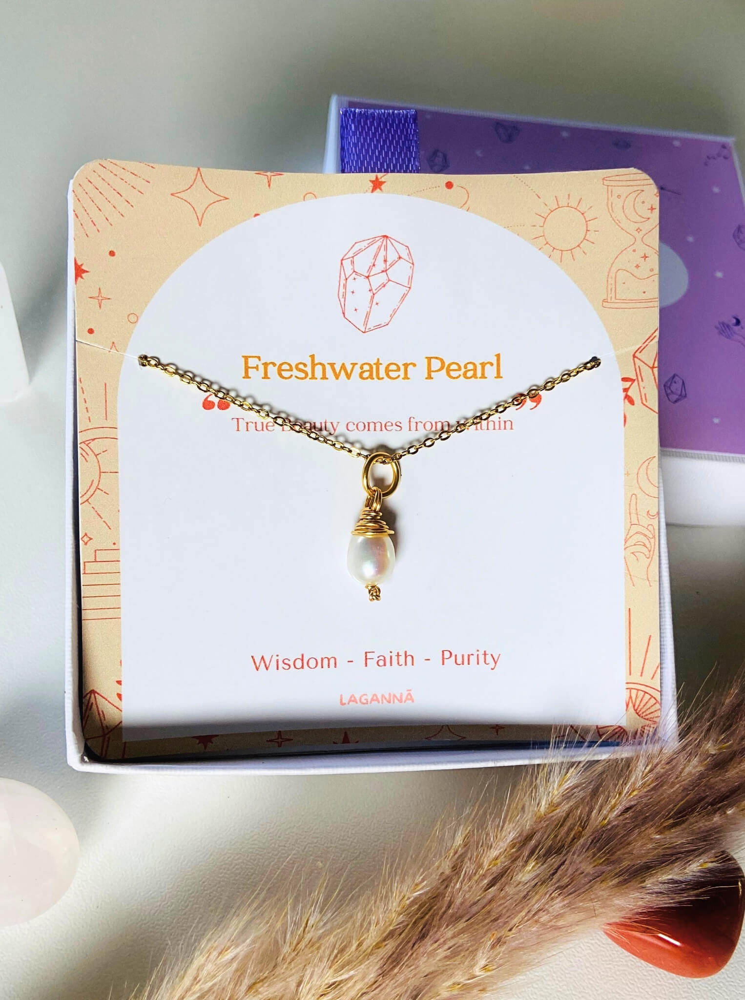 Handmade freshwater pearl necklace in gold wire wrap with jewelry box closeup, Sri Lankan pearl pendant jewelry for elegance and feminine energy