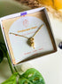 Freshwater pearl necklace in elegant jewelry box aesthetic styling, handmade Sri Lankan gold wire wrapped pendant for emotional balance and tranquility