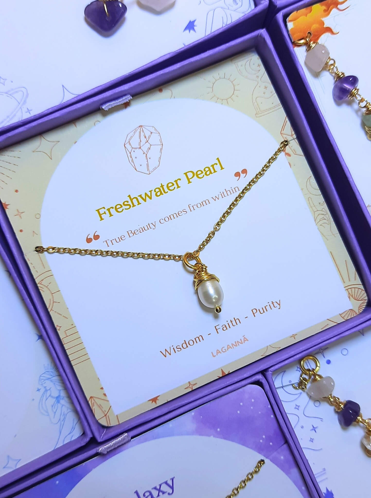 Handmade freshwater pearl necklace jewelry box side view showing gold wire wrapped design, Sri Lankan pearl pendant for wisdom and calming energy