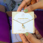 Freshwater pearl necklace jewelry card held in hand, handmade Sri Lankan gold wire wrapped pearl pendant gift for elegance and feminine energy