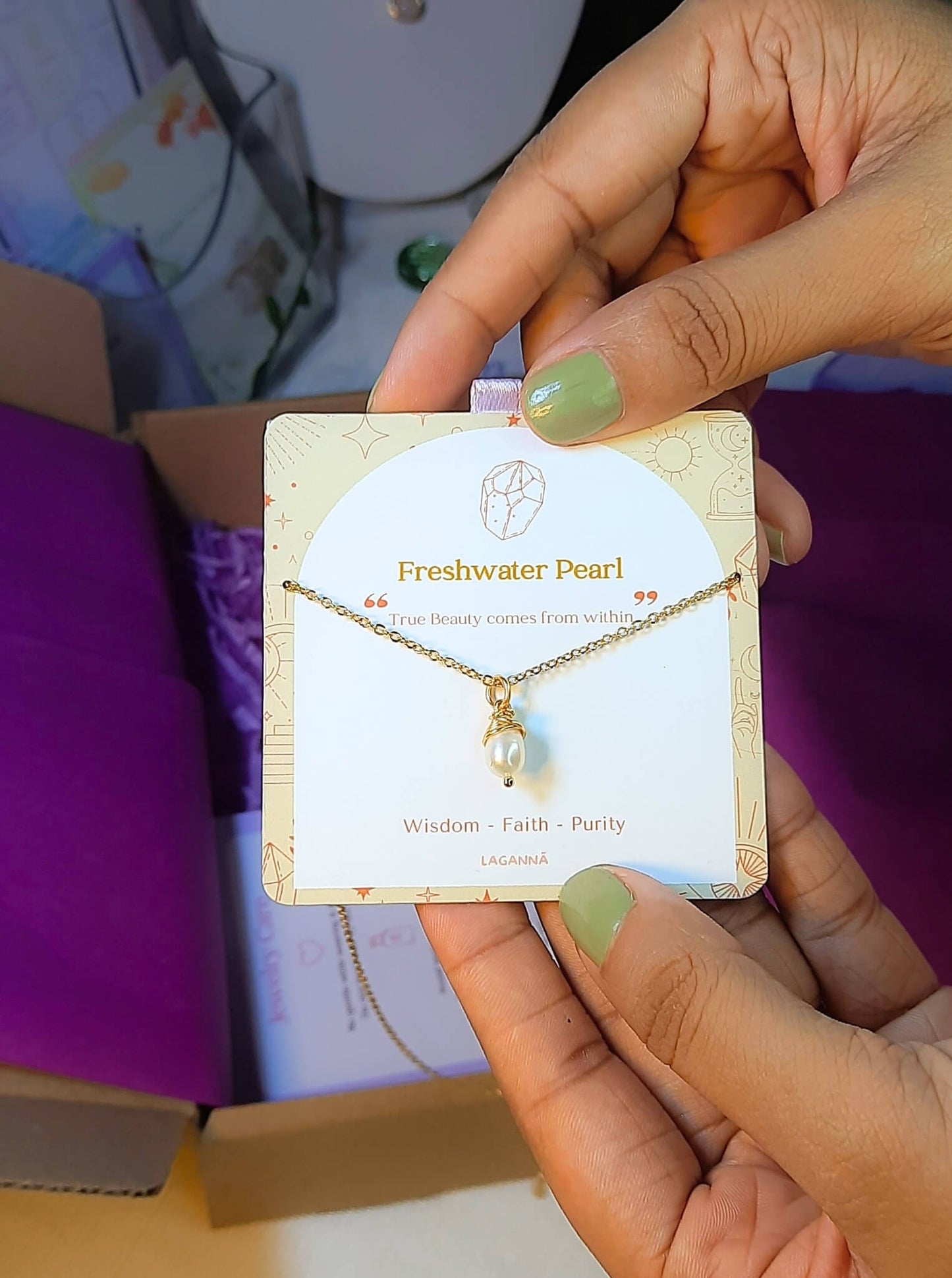 Freshwater pearl necklace jewelry card held in hand, handmade Sri Lankan gold wire wrapped pearl pendant gift for elegance and feminine energy