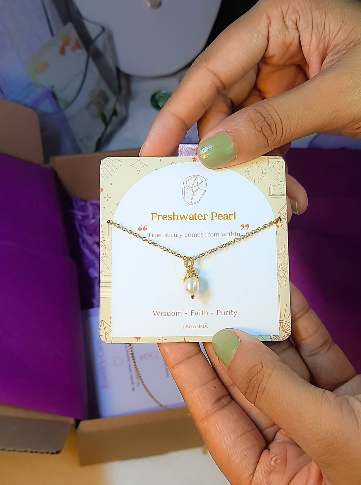 Freshwater pearl necklace jewelry card held in hand, handmade Sri Lankan gold wire wrapped pearl pendant gift for elegance and feminine energy
