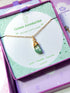 Laganna handmade green aventurine irregular stone gold necklace for luck, wealth and success displayed in purple Laganna box