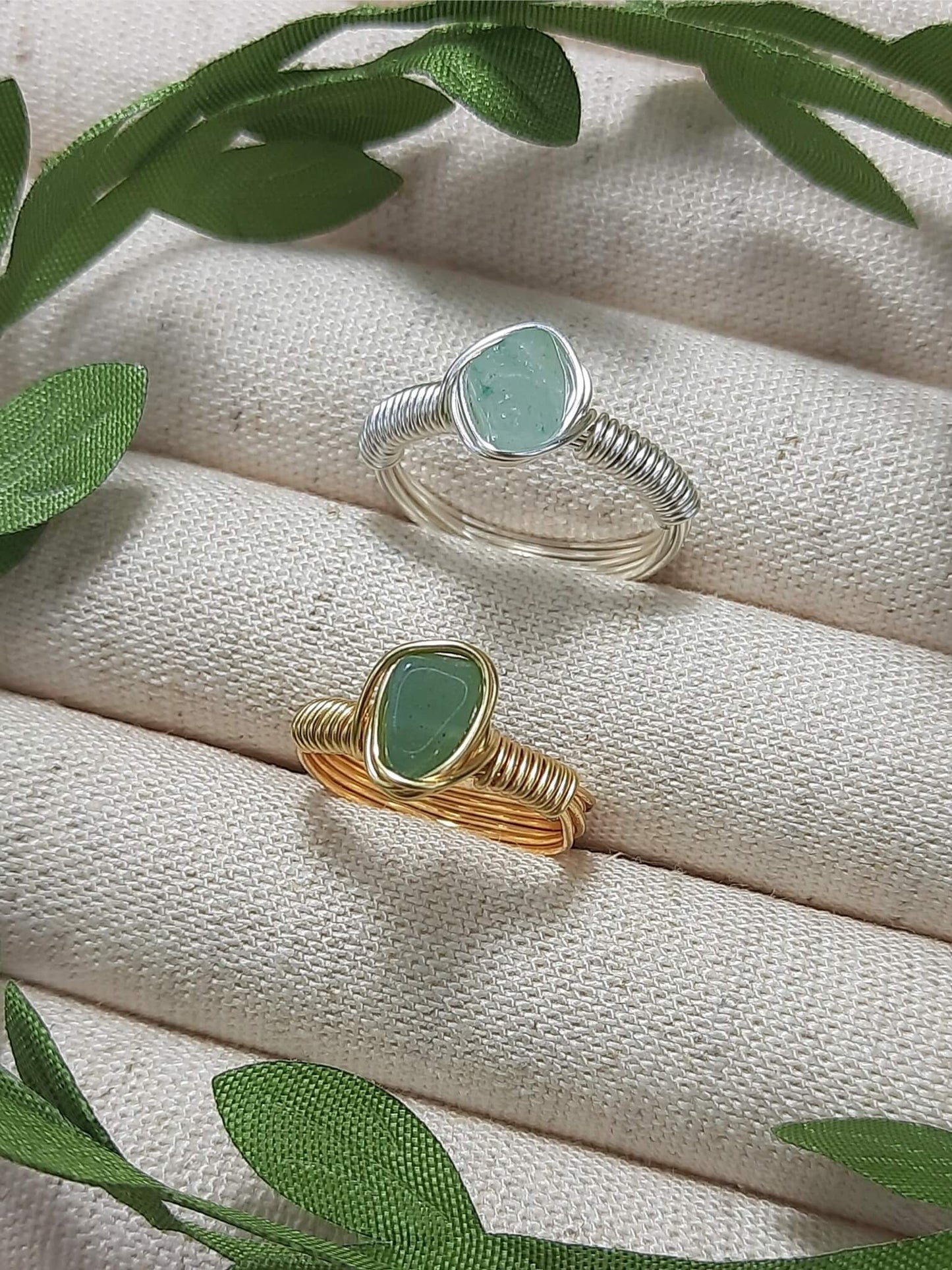 Handmade green aventurine irregular stone rings in gold and silver wire wrapped designs featuring natural healing crystal jewelry crafted by Sri Lankan artisans as luck stone rings and heart chakra balancing amulets for women seeking prosperity and abundance with raw gemstone energy