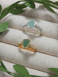 Handmade green aventurine irregular stone rings in gold and silver wire wrapped designs featuring natural healing crystal jewelry crafted by Sri Lankan artisans as luck stone rings and heart chakra balancing amulets for women seeking prosperity and abundance with raw gemstone energy
