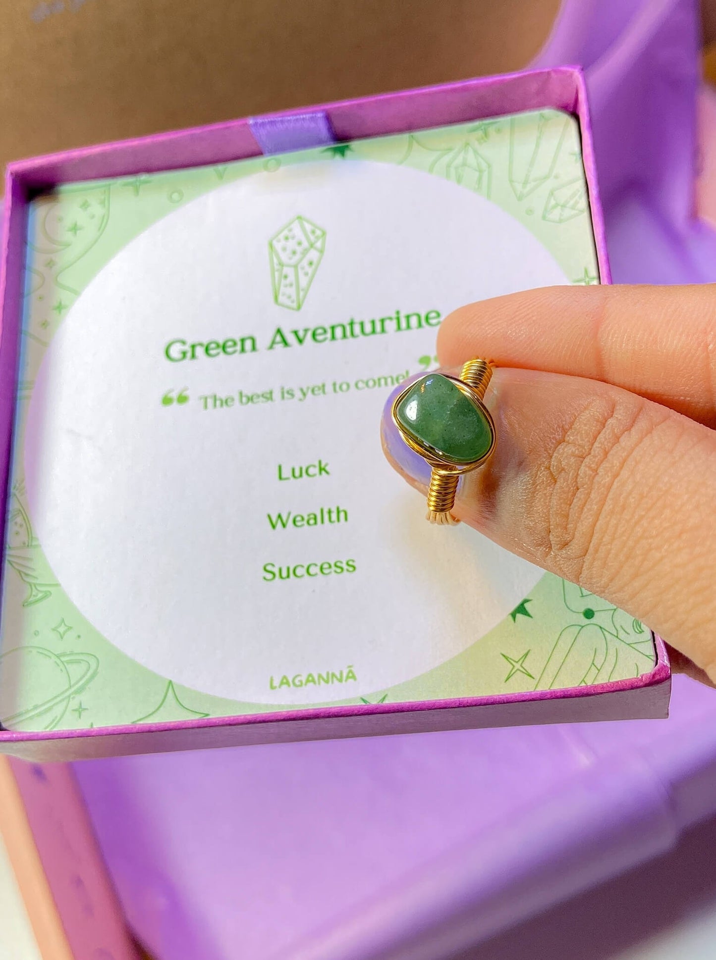 Green aventurine irregular stone ring holding on hand showing handmade gold wire wrapped healing crystal jewelry lifestyle, Sri Lankan spiritual ring featuring natural green gemstone perfect as boho luck stone ring and prosperity amulet for abundance and good fortune