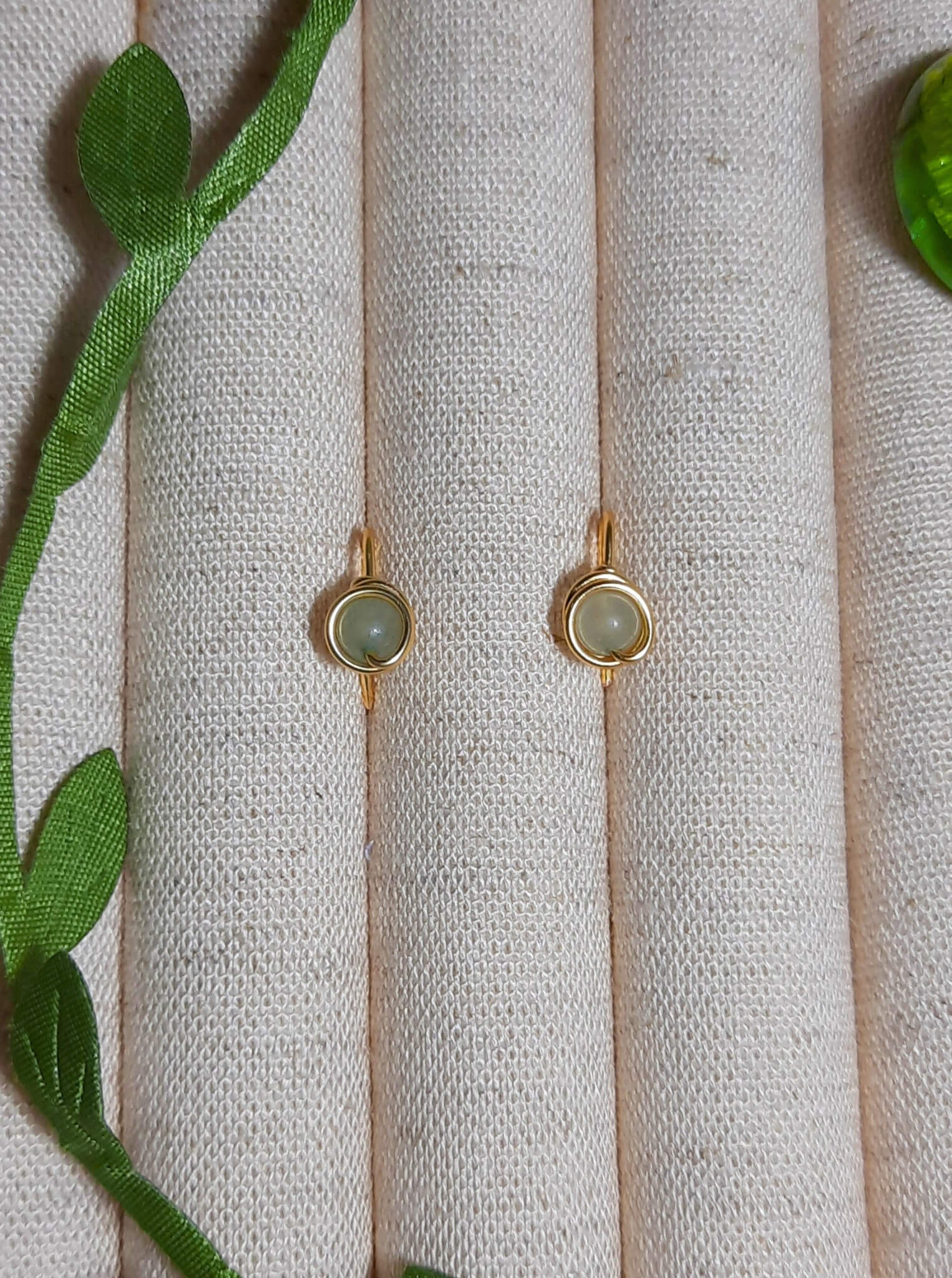 Green Aventurine Mini Round Stud Earrings packaging with crystal meaning card - handcrafted wire-wrapped healing jewelry gift from Sri Lanka featuring natural green aventurine stone for luck, wealth, and success
