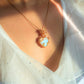 Handmade Opalite heart pendant necklace with gold wire wrapping worn on model – hope and heaven crystal jewelry handcrafted in Sri Lanka, meaningful gift for her
