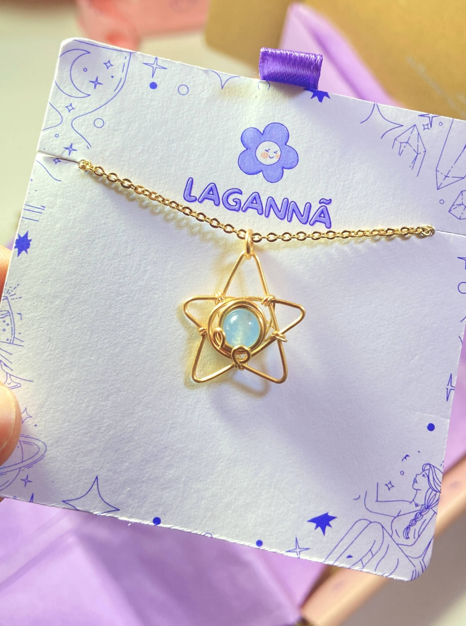 Blue chalcedony heavenly star necklace displayed on elegant Laganna card, showcasing celestial gold wire wrapped design - handmade healing crystal jewelry from Sri Lanka for hope and spiritual clarity