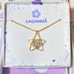 Stylish blue chalcedony heavenly star necklace in aesthetic flat lay styling, highlighting the celestial minimalist gold wire wrapped design - handmade healing crystal jewelry from Sri Lanka for hope and calming energy