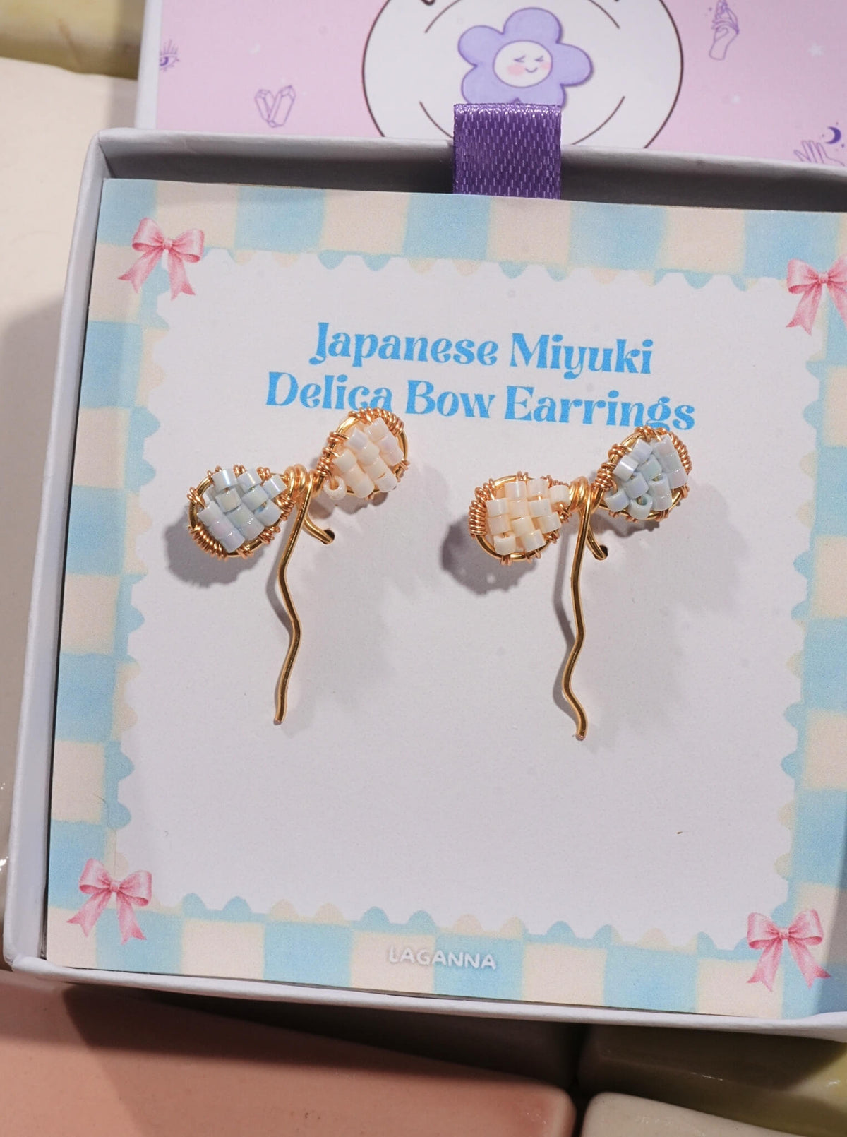 Japanese Miyuki Delica bow earrings gold wire-wrapped powder blue cream glass beads in Laganna gift box, handmade artisan jewelry Sri Lanka

