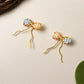 Handmade Japanese Miyuki Delica glass bead bow earrings in soft pastel peach and blue tones, lightweight wire-wrapped artisan jewelry Sri Lanka, dainty bow earrings for women, feminine handcrafted accessories by Laganna