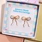 Japanese Miyuki Delica bow earrings in Laganna gift box packaging, handmade wire-wrapped artisan jewelry Sri Lanka, delicate feminine bow design with premium glass beads in powder blue and cream white, lightweight stud earrings for women by Laganna