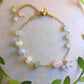 Handmade Jeju Flower Bracelet featuring wire-wrapped rose quartz and green aventurine healing stones, inspired by Korean K-drama culture and buckwheat flower symbolism, artisan jewelry crafted in Sri Lanka