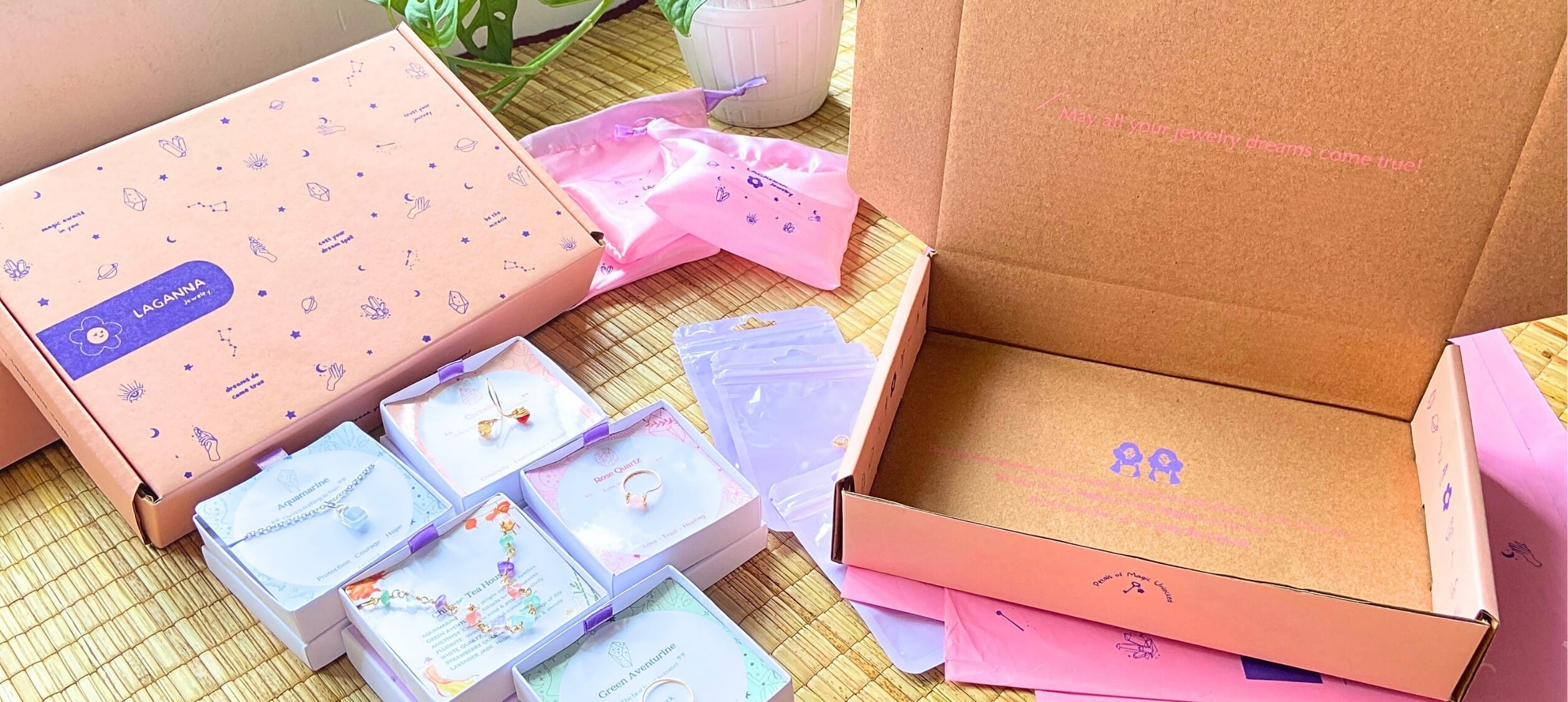 Laganna luxury jewelry gift packaging collection featuring elegant peach and pink gift boxes with mystical celestial patterns, jewelry presentation cards, branded packaging materials, and premium gift wrapping accessories for jewelry gifts and special occasions