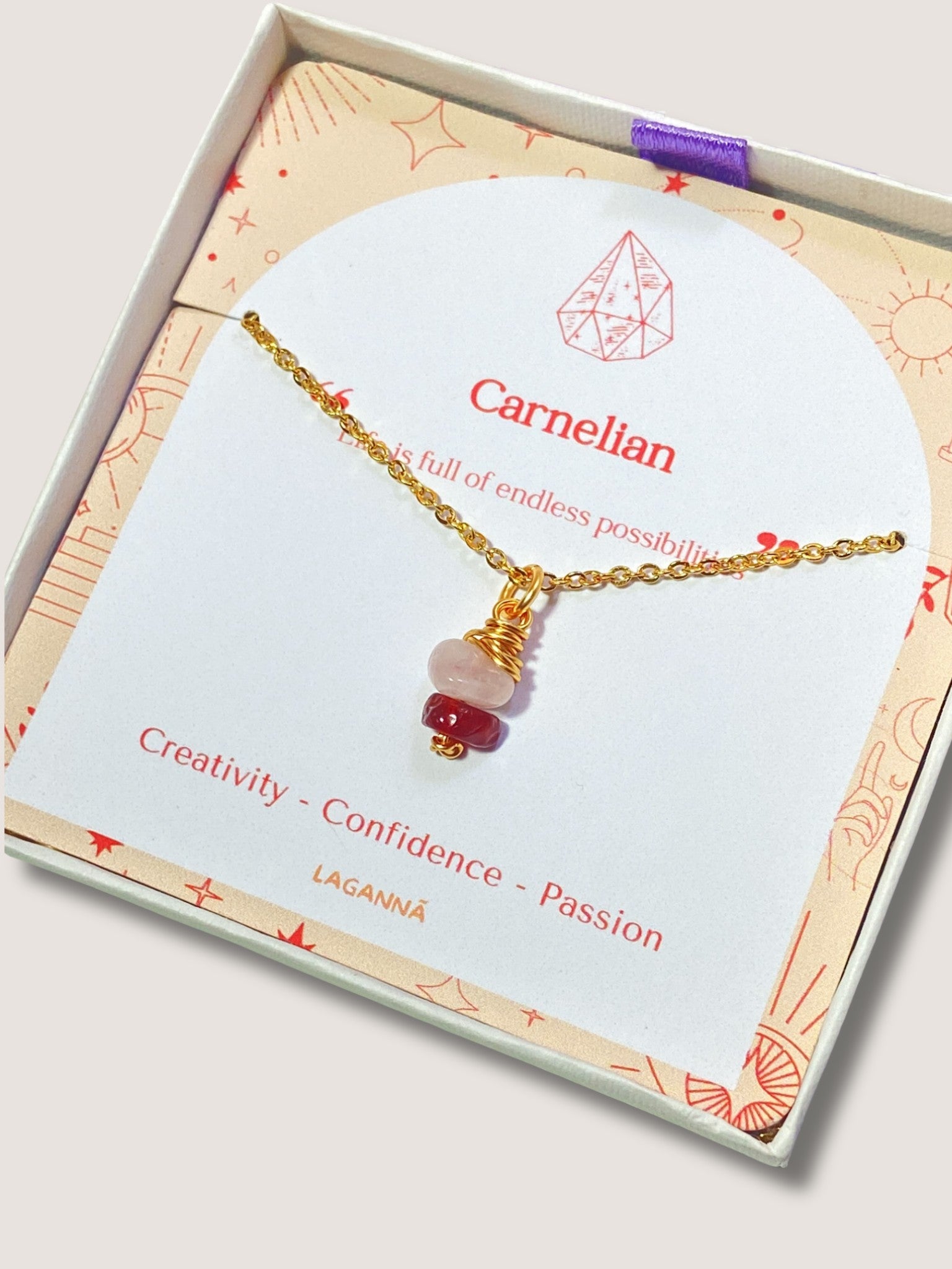 Laganna handmade Love Duo irregular stone necklace with rose quartz and carnelian for love and confidence displayed in Laganna jewelry box
