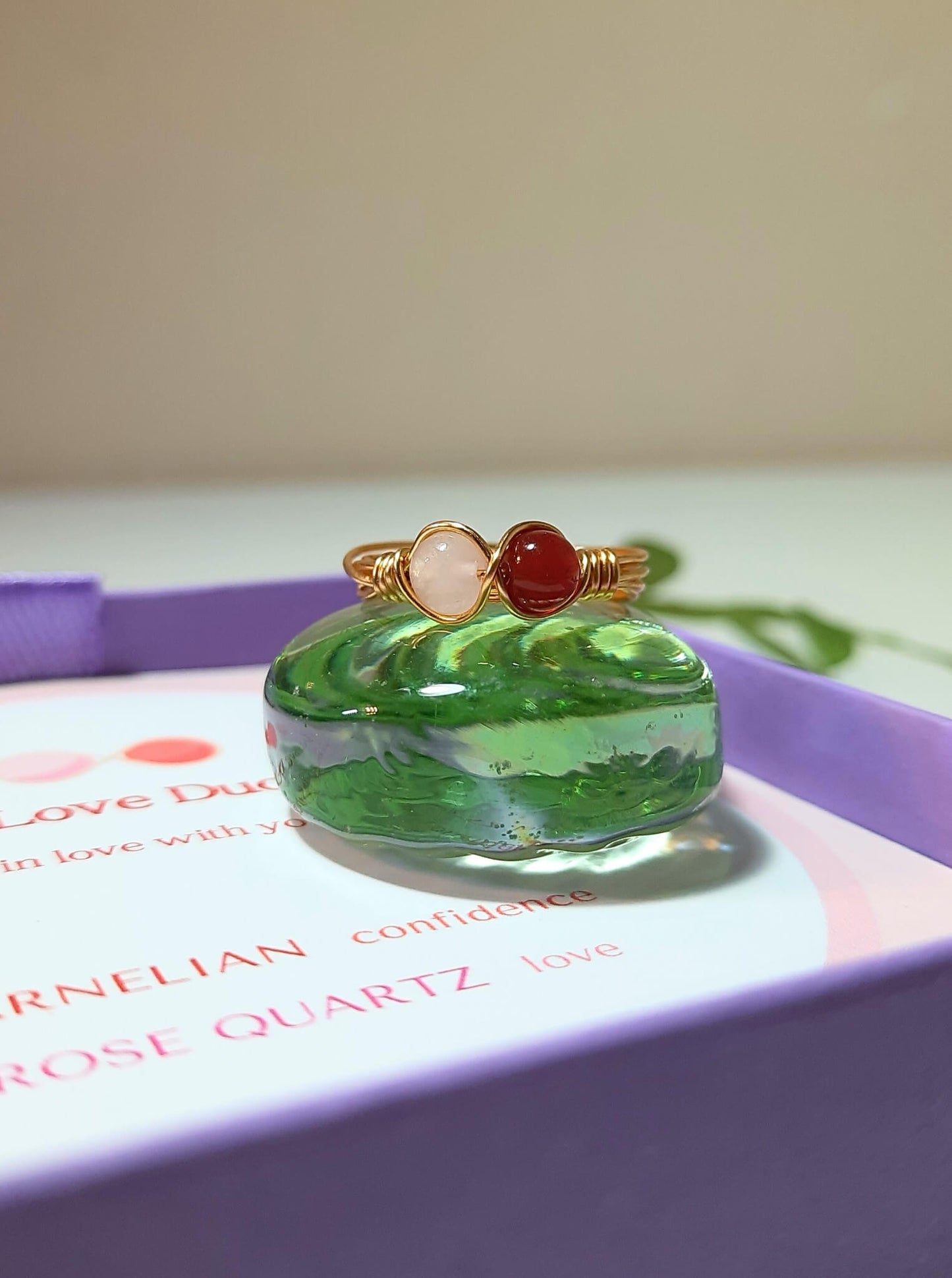  Love Duo ring with rose quartz and carnelian in jewelry box, handmade Sri Lankan gold wire wrapped dual crystal ring for heart chakra and confidence