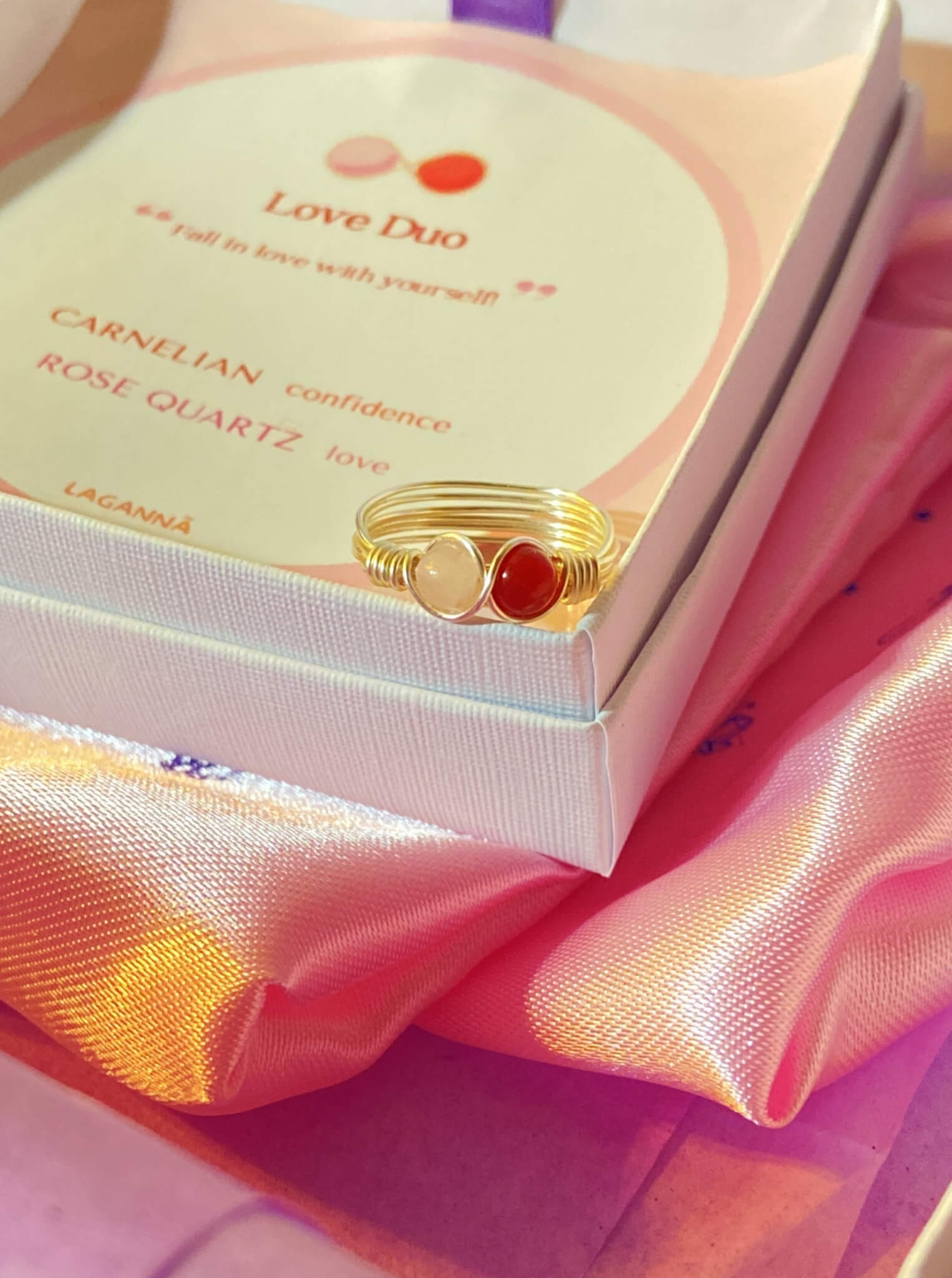 Love Duo silver ring close-up showing rose quartz and carnelian dual stones in wire-wrapped setting - handmade Sri Lankan crystal healing jewelry for love, creativity, and emotional balance