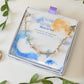 Moon and Sea bracelet with moonstone and aquamarine chip stones laid on Laganna Moon and Sea gift box, handmade Sri Lankan gold wire wrapped dual crystal bracelet for new beginnings and courage
