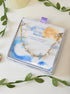 Moon and Sea bracelet with moonstone and aquamarine chip stones laid on Laganna Moon and Sea gift box, handmade Sri Lankan gold wire wrapped dual crystal bracelet for new beginnings and courage
