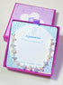Moon and Sea bracelet jewelry box closeup side view showing moonstone and aquamarine, handmade Sri Lankan silver wire wrapped dual crystal bracelet for emotional healing and clarity