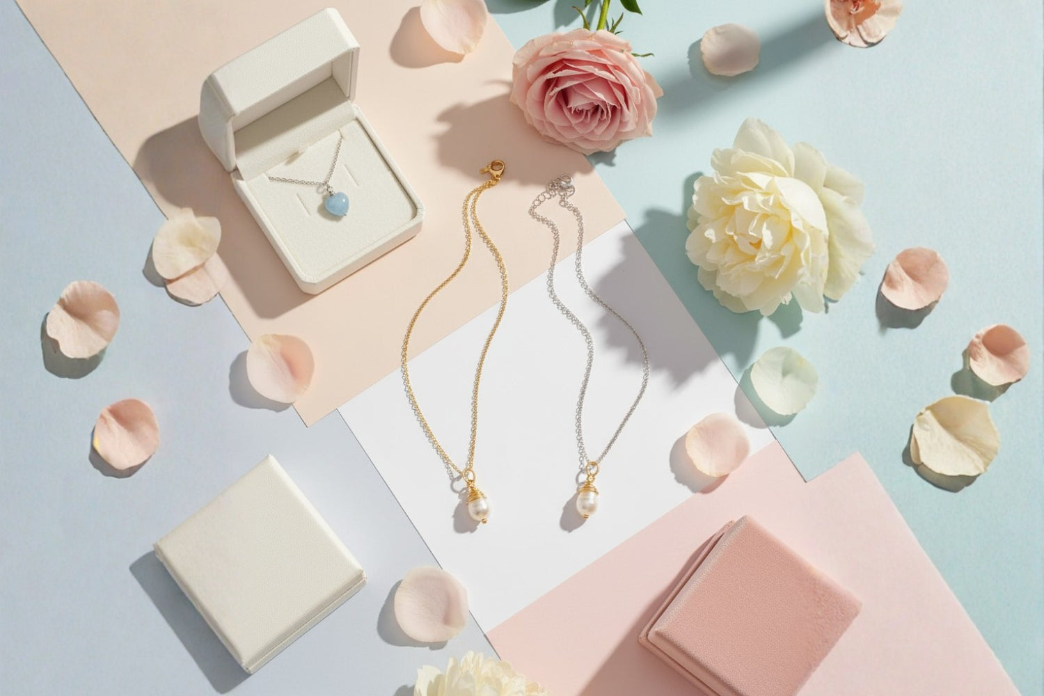 Clean heartwarming aesthetic flat lay featuring Freshwater Pearl necklace and Sweet Heart blue chalcedony necklace in tender Mother's Day styling