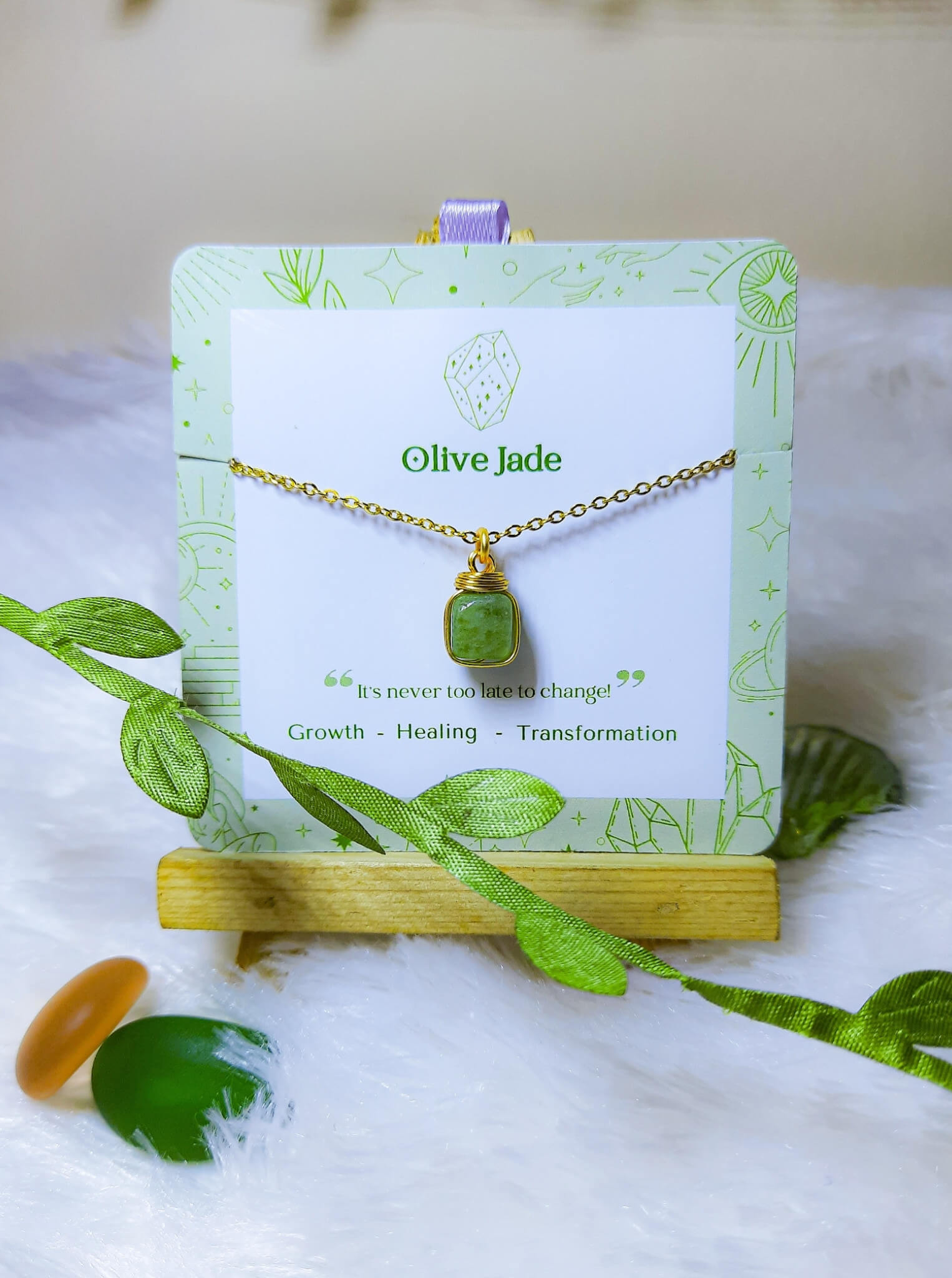 Handmade olive jade square stone necklace in gold wire wrapped design on jewelry card featuring natural healing crystal jewelry crafted by Sri Lankan artisans as heart chakra balancing pendant and abundance enhancement amulet for women seeking prosperity and emotional healing with geometric green gemstone