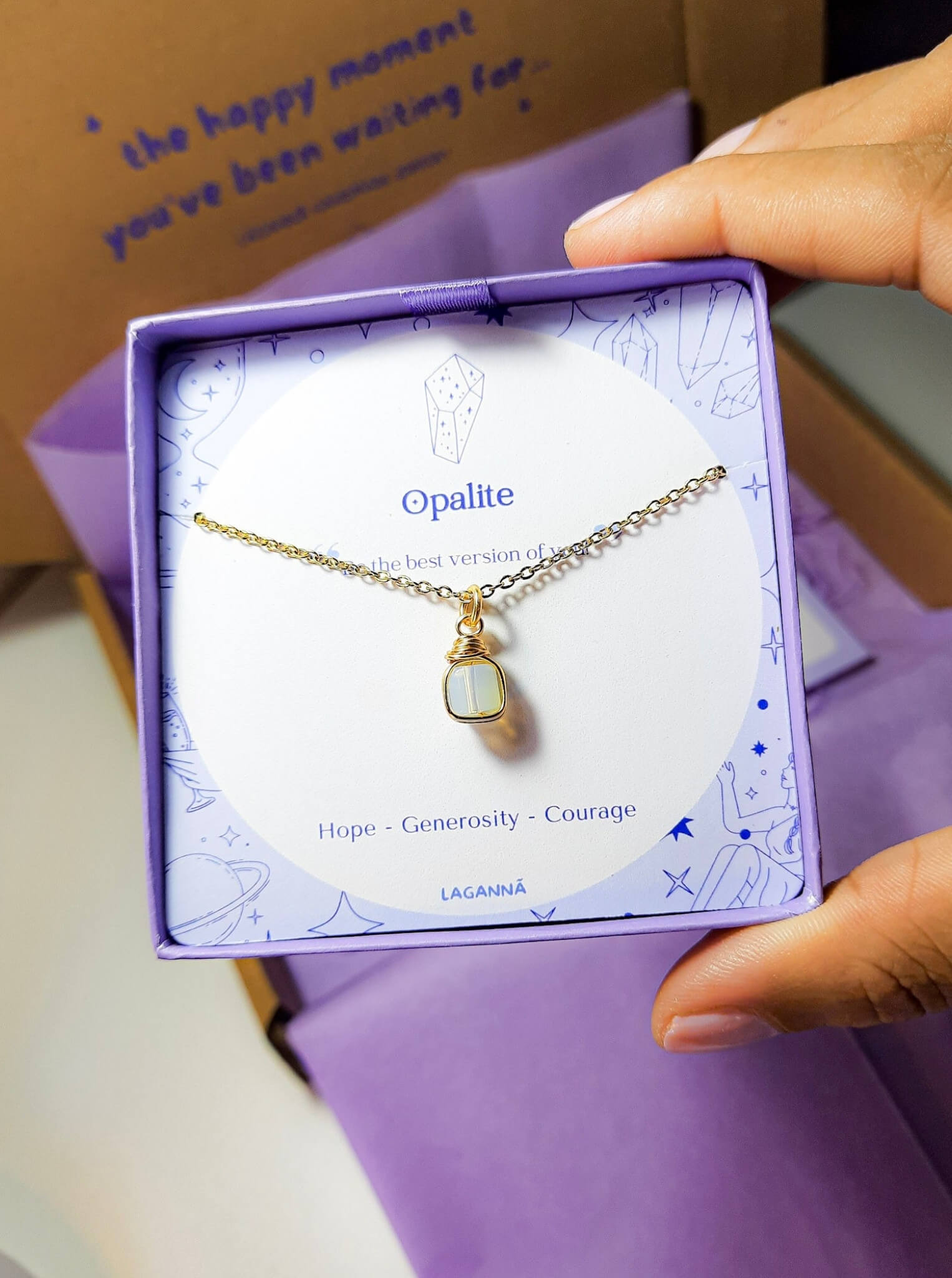 Opalite square stone necklace jewelry box held on hand, handmade Sri Lankan gold wire wrapped healing crystal pendant gift for spiritual awakening