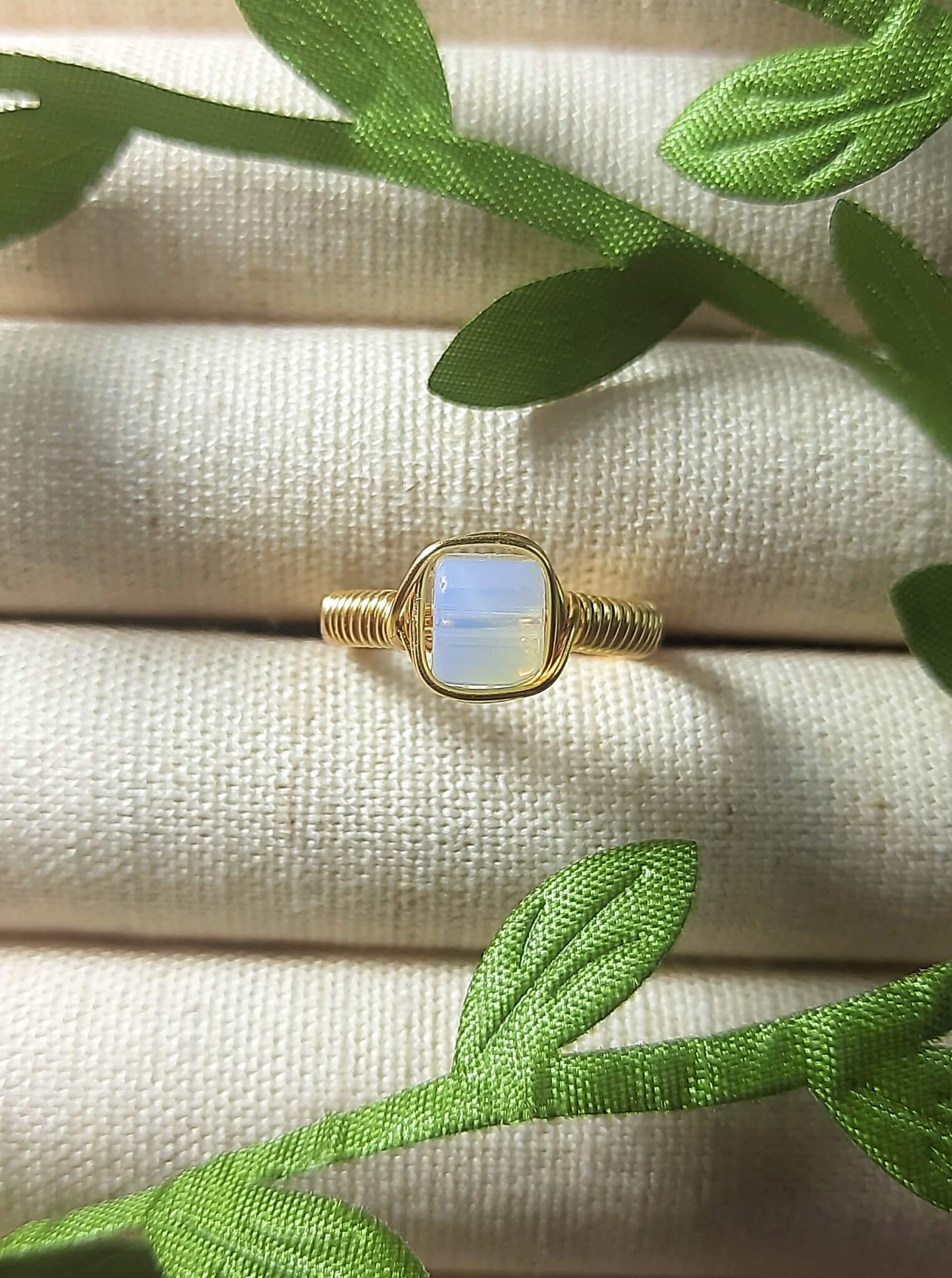 Opalite square stone ring with aesthetic jewelry display, handmade Sri Lankan gold wire wrapped healing crystal ring for spiritual awakening and transformation