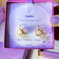 Opalite Statement Round Stud Earrings packaging with crystal meaning card - handcrafted wire-wrapped healing jewelry gift from Sri Lanka featuring natural opalite stone for hope, resilience, and inner light