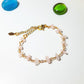 Petal of Love Rose Quartz Bracelet on white background showcasing gold wire wrapped rose quartz crystals for love and healing, handmade in Sri Lanka