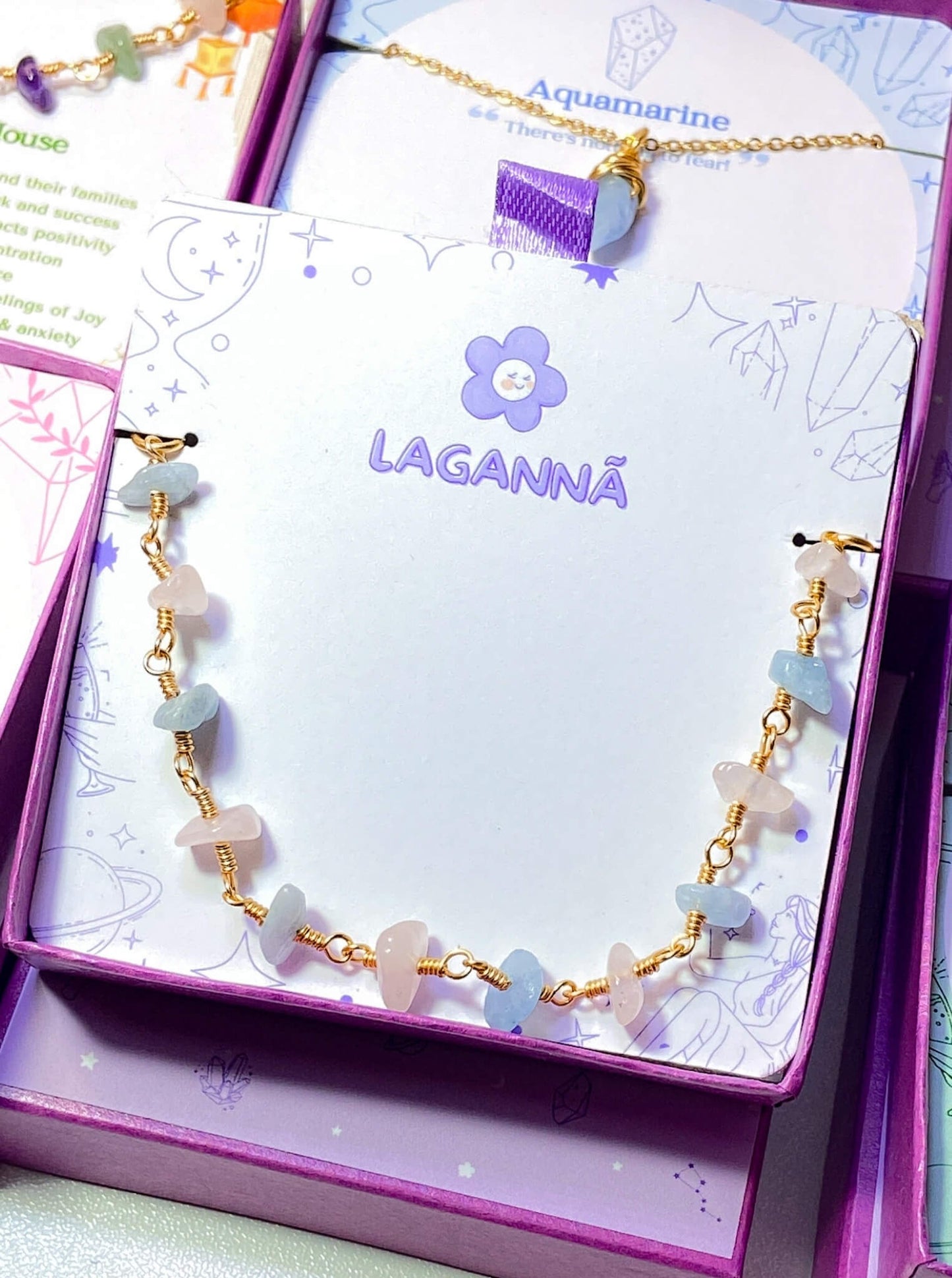 Laganna handmade Petal and Sea gold wire wrapped bracelet with rose quartz and aquamarine for love and calm in jewelry box
