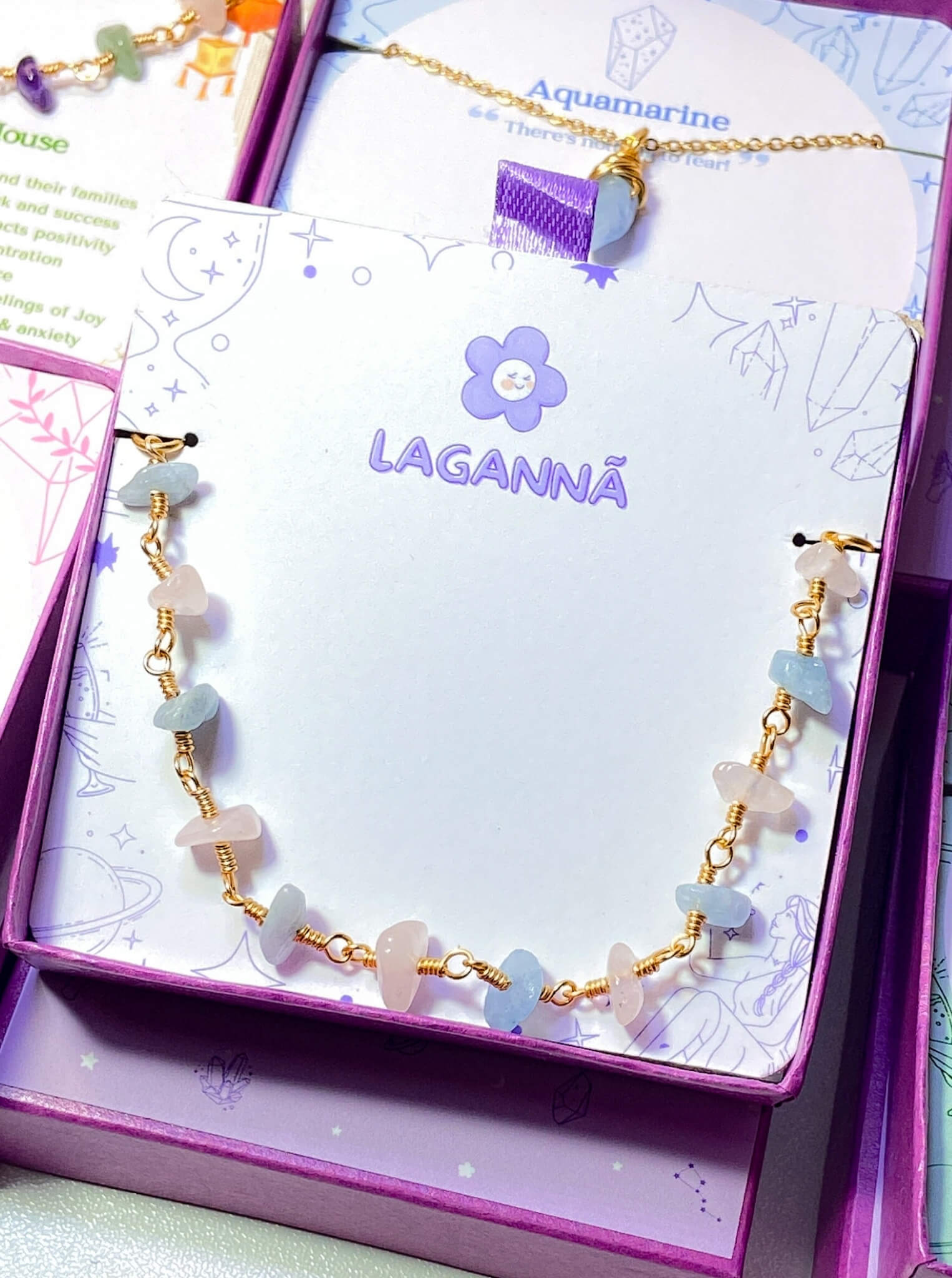 Laganna handmade Petal and Sea gold wire wrapped bracelet with rose quartz and aquamarine for love and calm in jewelry box