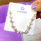 Laganna handmade Petal and Sea gold wire wrapped bracelet with rose quartz and aquamarine for love and calm on Laganna jewelry card