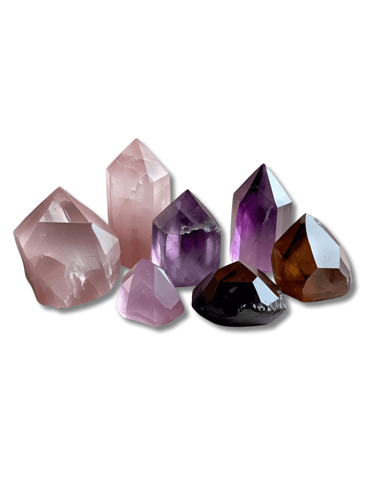 Raw pink, purple, and brown healing crystals displayed naturally — perfect for emotional healing, balance, and spiritual energy.