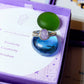 Handmade purple jade irregular stone ring in silver wire wrapped design on jewelry box featuring natural healing crystal jewelry crafted by Sri Lankan artisans as wisdom stone ring and crown chakra balancing amulet for women seeking spiritual growth and inner peace with raw purple gemstone energy