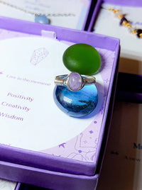 Handmade purple jade irregular stone ring in silver wire wrapped design on jewelry box featuring natural healing crystal jewelry crafted by Sri Lankan artisans as wisdom stone ring and crown chakra balancing amulet for women seeking spiritual growth and inner peace with raw purple gemstone energy