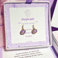 Purple Jade Petite Round Stud Earrings lifestyle shot with elegant packaging and care instructions - handmade crystal healing jewelry from Sri Lanka, perfect gift for mindful living and emotional balance